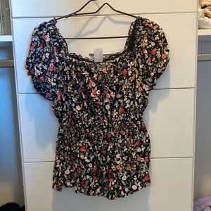 Black floral shirt with puffy sleeves and winched waistband